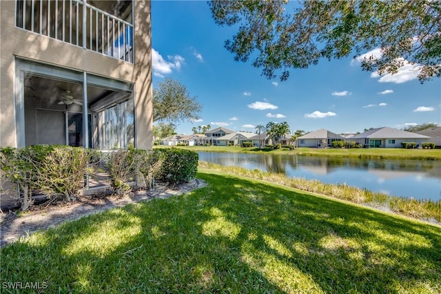 9321 Alamander Ct Unit 204, Fort Myers, FL 33919 - view of green lawn with a residential view and a water view