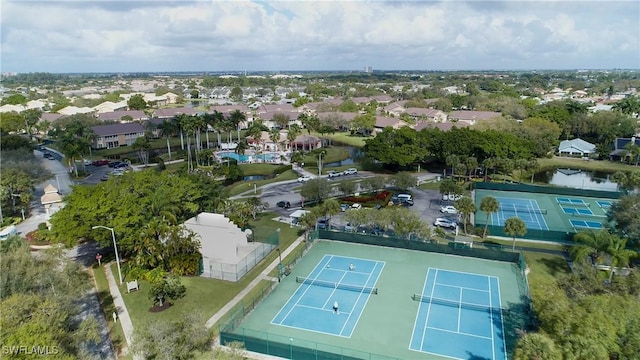 drone / aerial view with a residential view and a water view