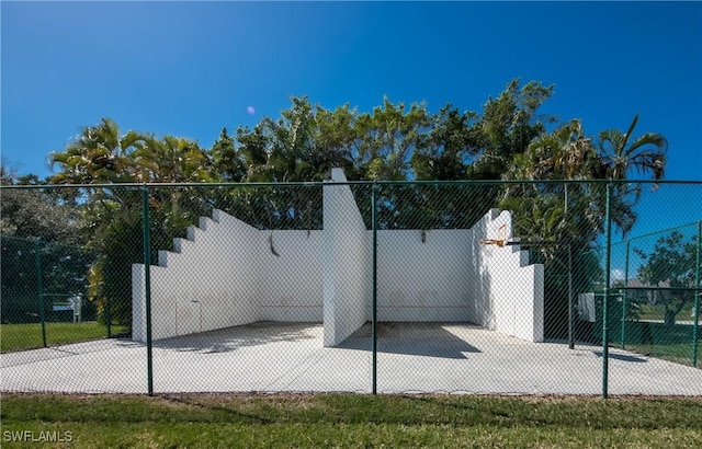 view of community with fence