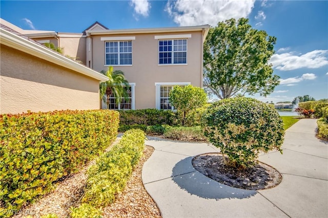 9321 Alamander Ct Unit 204, Fort Myers, FL 33919 - view of side of property featuring stucco siding