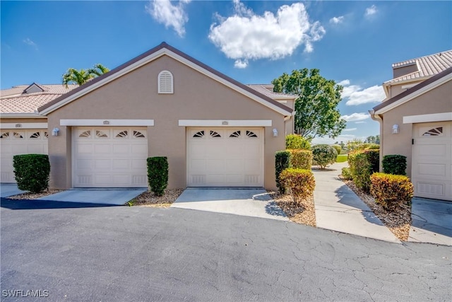 9321 Alamander Ct Unit 204, Fort Myers, FL 33919 - view of front of home featuring stucco siding