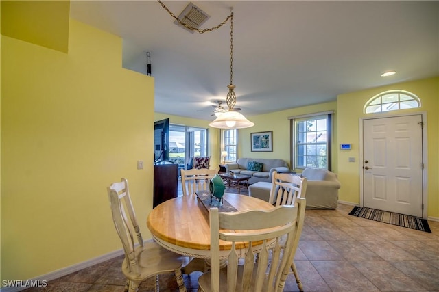 dining space with visible vents, baseboards, and tile patterned floors