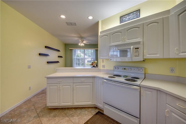 9321 Alamander Ct Unit 204, Fort Myers, FL 33919 - kitchen with white appliances, light countertops, recessed lighting, a ceiling fan, and white cabinetry