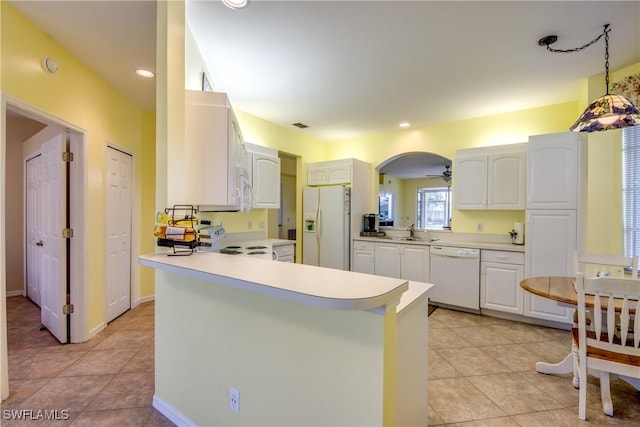 9321 Alamander Ct Unit 204, Fort Myers, FL 33919 - kitchen with white appliances, light countertops, light tile patterned flooring, a peninsula, and recessed lighting