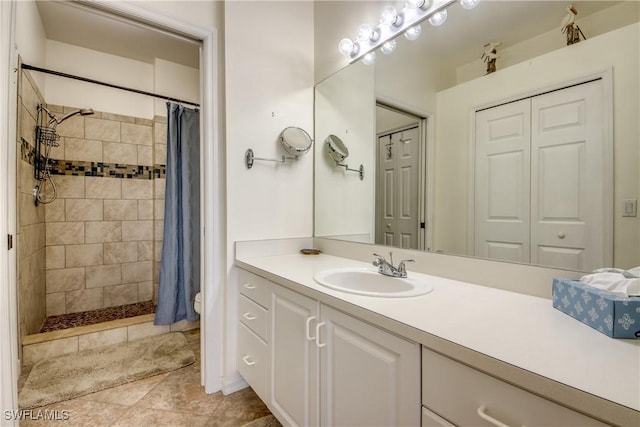 9321 Alamander Ct Unit 204, Fort Myers, FL 33919 - bathroom featuring vanity, a tile shower, tile patterned flooring, and a closet