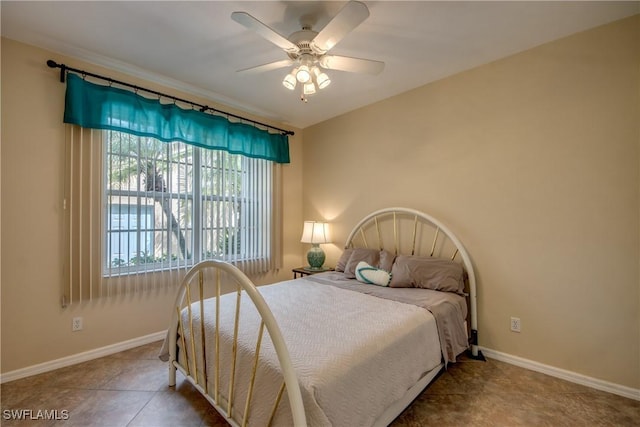 9321 Alamander Ct Unit 204, Fort Myers, FL 33919 - tiled bedroom featuring baseboards and ceiling fan