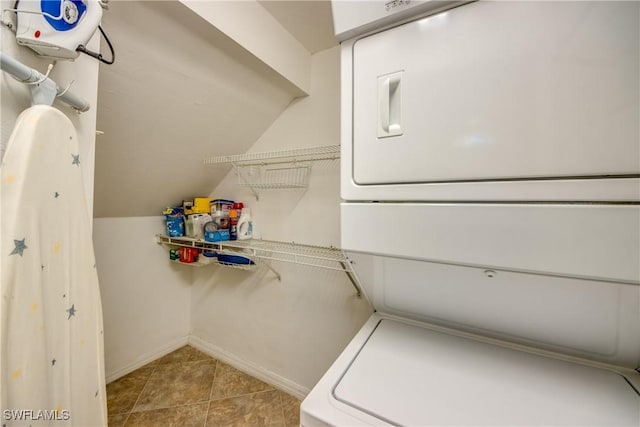 9321 Alamander Ct Unit 204, Fort Myers, FL 33919 - laundry room with stacked washer and clothes dryer and light tile patterned floors