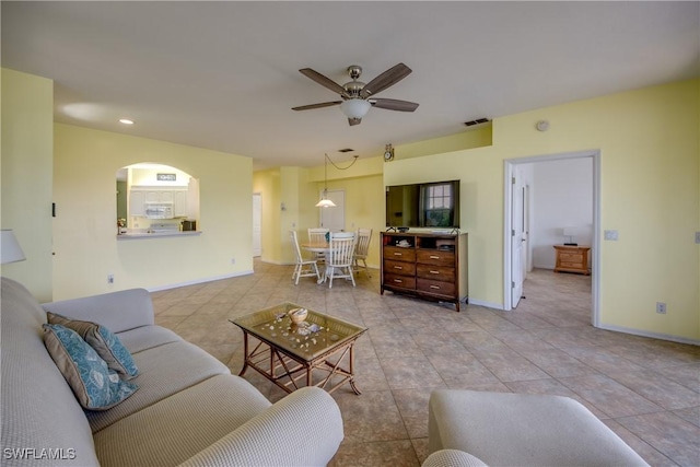 9321 Alamander Ct Unit 204, Fort Myers, FL 33919 - living area with a ceiling fan, light tile patterned flooring, arched walkways, and recessed lighting
