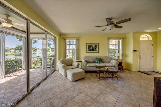 9321 Alamander Ct Unit 204, Fort Myers, FL 33919 - living area with ceiling fan, a water view, and tile patterned flooring