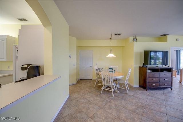 9321 Alamander Ct Unit 204, Fort Myers, FL 33919 - dining room featuring baseboards and arched walkways