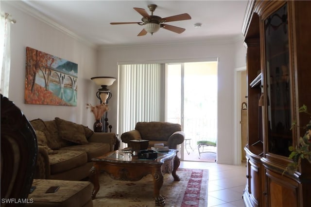 living room with ornamental molding, light tile patterned flooring, and ceiling fan