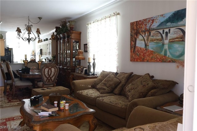 living area with a chandelier and crown molding