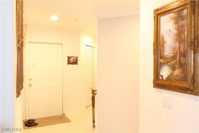 hallway with recessed lighting, crown molding, and tile patterned floors