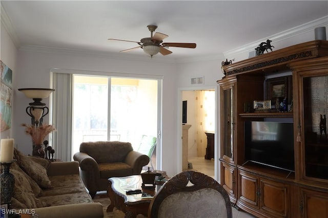 living area featuring ornamental molding, visible vents, and ceiling fan