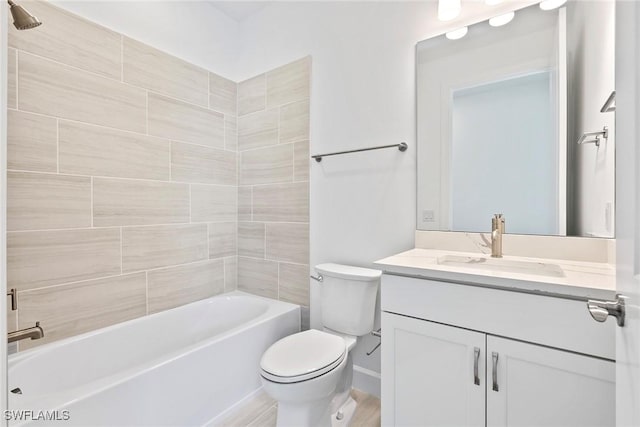 full bathroom featuring  shower combination, vanity, and toilet