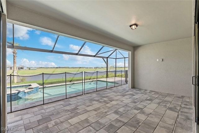 interior space featuring a pool with connected hot tub and glass enclosure