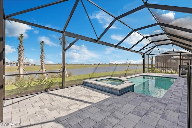 view of pool featuring a lanai, a water view, a pool with connected hot tub, and a patio