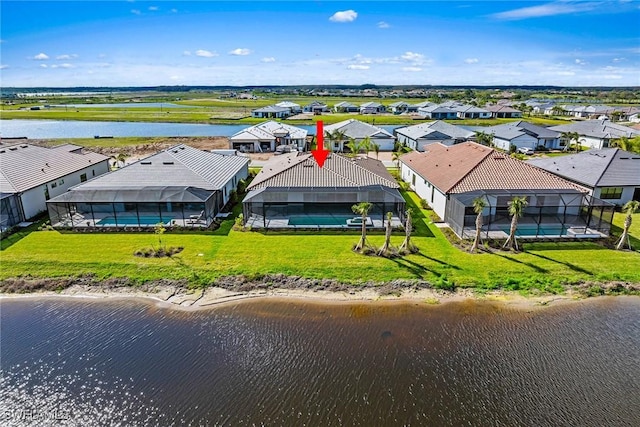 bird's eye view with a residential view and a water view