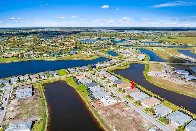 birds eye view of property featuring a residential view and a water view