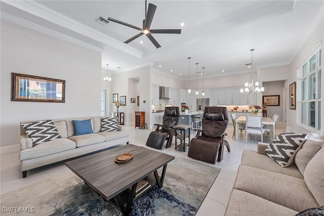 living room with recessed lighting, ceiling fan with notable chandelier, crown molding, and baseboards