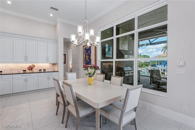 dining area with baseboards, visible vents, marble finish floor, and ornamental molding