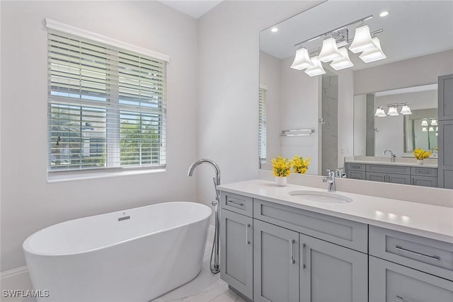 bathroom with vanity, a soaking tub, a shower, and marble finish floor