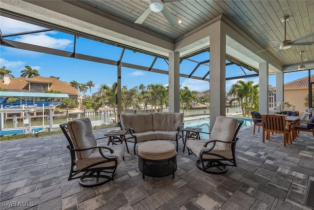 sunroom / solarium with wooden ceiling and a ceiling fan