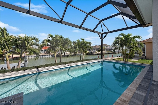 pool with glass enclosure and a water view