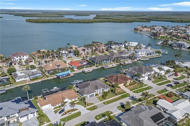 aerial view with a residential view and a water view