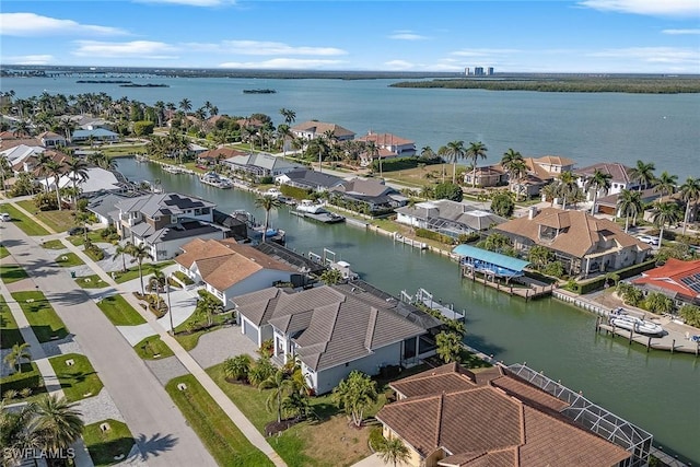 bird's eye view with a residential view and a water view