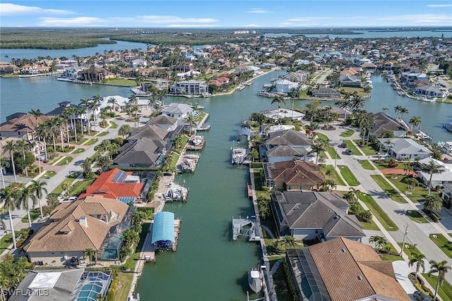 bird's eye view with a residential view and a water view