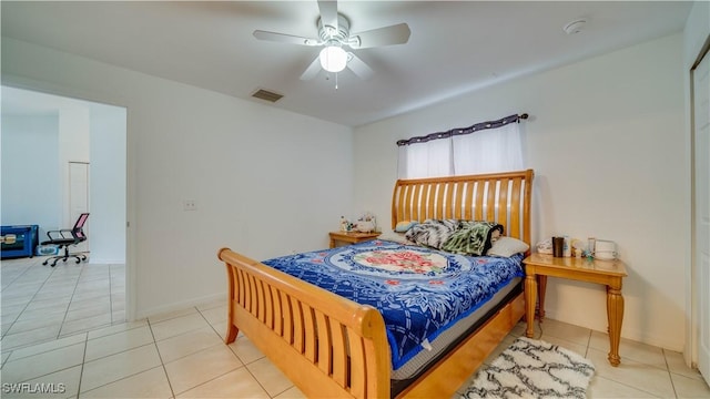 bedroom featuring light tile patterned floors, a ceiling fan, and visible vents