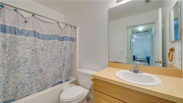 bathroom with vanity, shower / tub combo, toilet, and visible vents