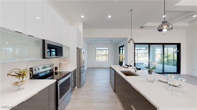 1523 NW 34th Ave, Cape Coral, FL 33993 - kitchen featuring stainless steel appliances, modern cabinets, light wood finished floors, and recessed lighting
