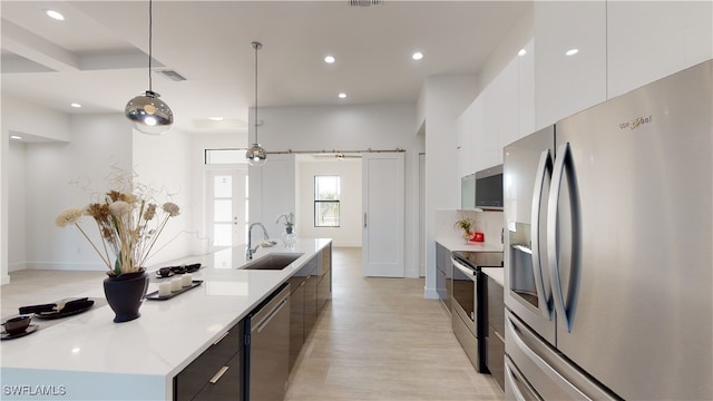 1523 NW 34th Ave, Cape Coral, FL 33993 - kitchen with stainless steel appliances, modern cabinets, white cabinets, recessed lighting, and a large island