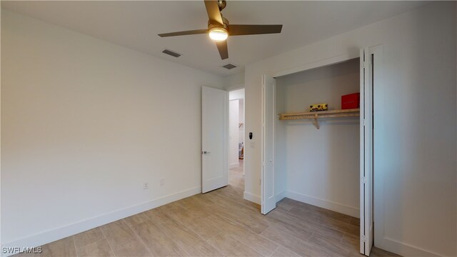 1523 NW 34th Ave, Cape Coral, FL 33993 - unfurnished bedroom featuring a closet, light wood finished floors, and ceiling fan