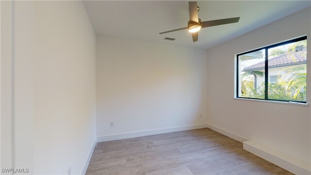 1523 NW 34th Ave, Cape Coral, FL 33993 - empty room featuring a ceiling fan and baseboards