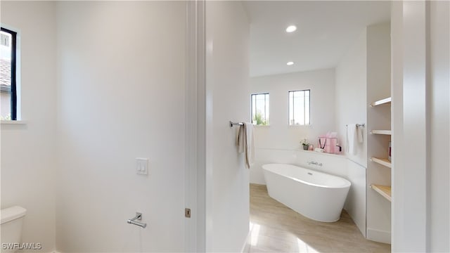 1523 NW 34th Ave, Cape Coral, FL 33993 - full bathroom with a freestanding bath, wood finished floors, and recessed lighting