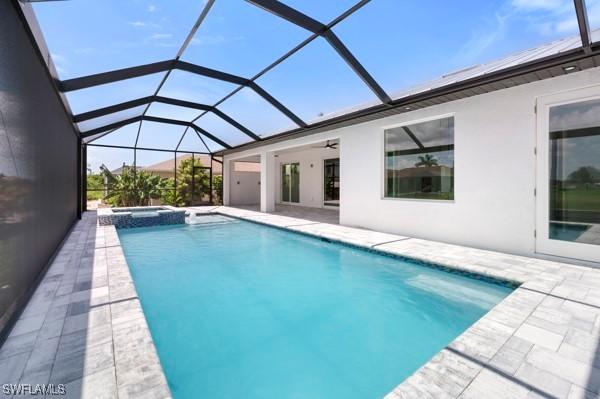 1523 NW 34th Ave, Cape Coral, FL 33993 - view of pool featuring a patio, a pool with connected hot tub, ceiling fan, and a lanai