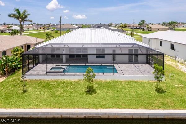 1523 NW 34th Ave, Cape Coral, FL 33993 - view of pool featuring a patio area, a residential view, a lanai, and a yard
