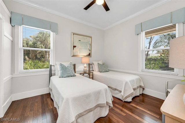 bedroom featuring multiple windows, hardwood / wood-style flooring, and crown molding