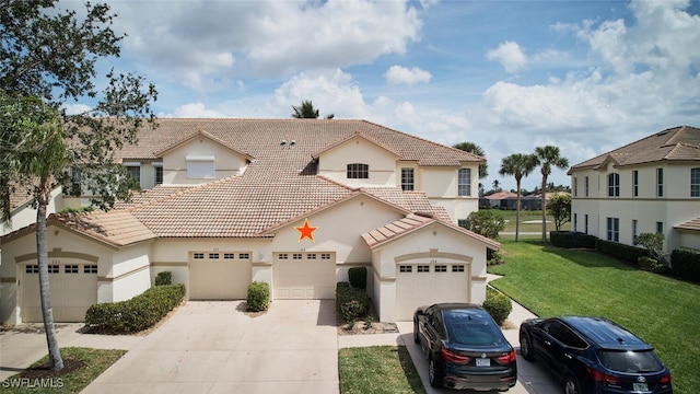 view of front facade featuring a tile roof, driveway, a front lawn, and stucco siding