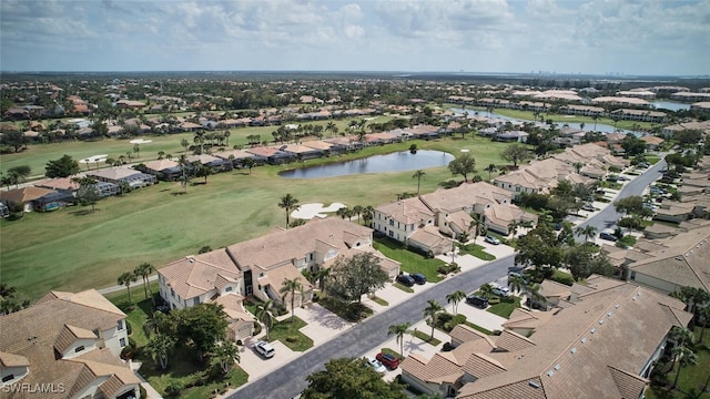 bird's eye view with a water view, a residential view, and golf course view