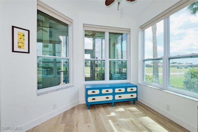 sunroom with a ceiling fan