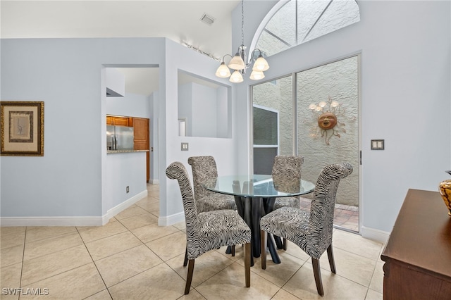 dining room with baseboards, light tile patterned flooring, visible vents, and an inviting chandelier