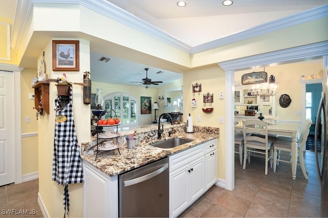 kitchen featuring a sink, visible vents, light stone counters, and stainless steel dishwasher