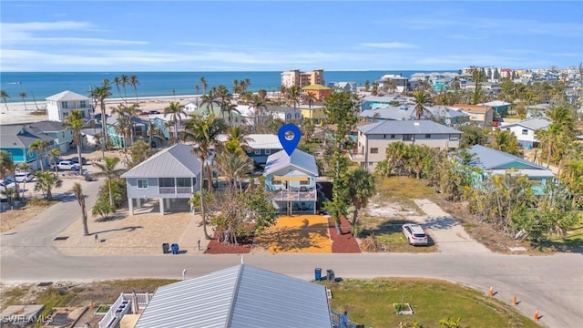 bird's eye view featuring a water view and a residential view