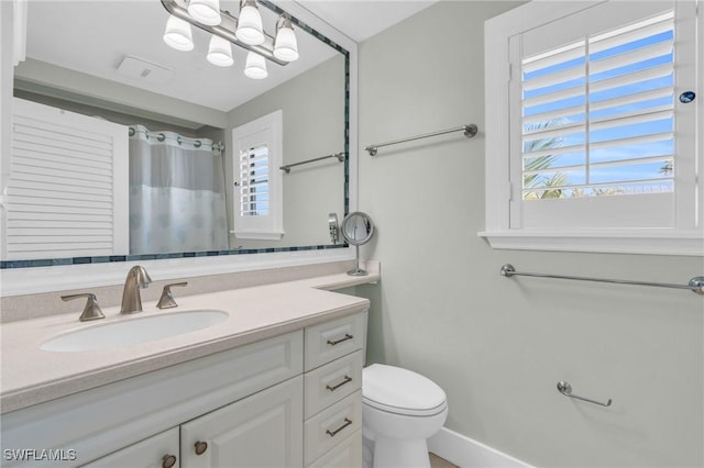 bathroom with visible vents, a shower with shower curtain, vanity, and toilet