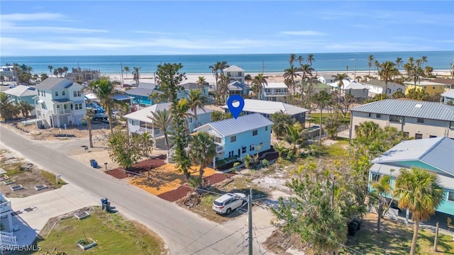 aerial view with a water view and a residential view