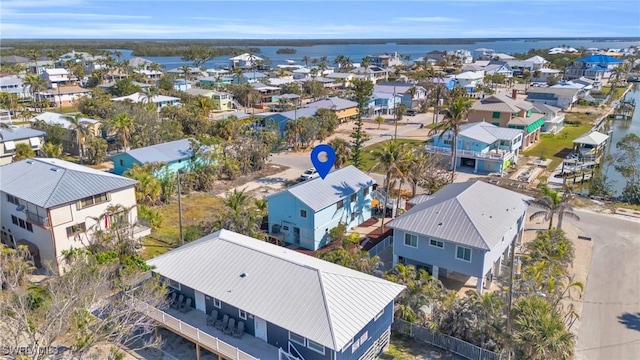 birds eye view of property featuring a water view and a residential view